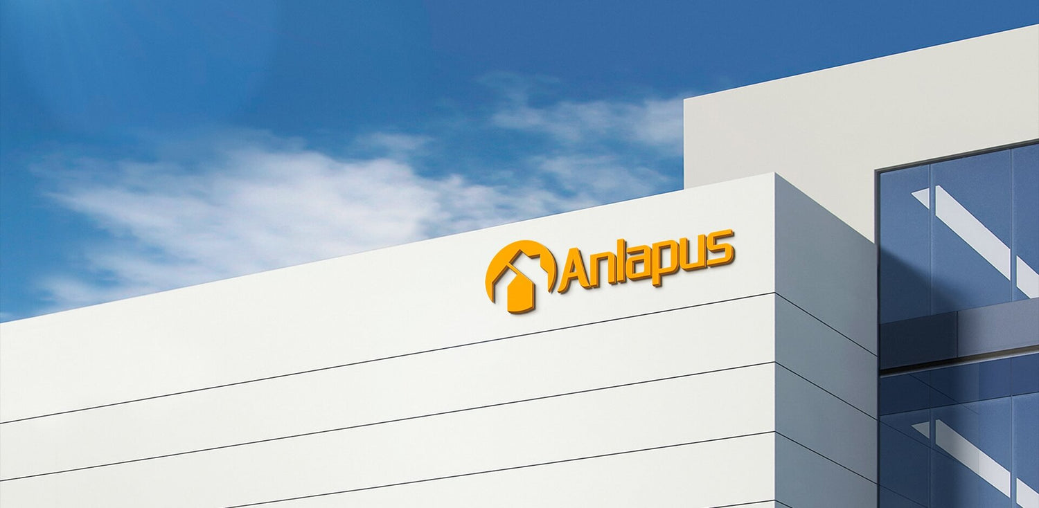 Anlapus 3D orange brand logo on modern white office building exterior, company brand banner image